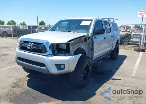 2012 Toyota Tacoma Base V6 z USA, uszkodzony, nr VIN 3TMLU4EN1CM087213